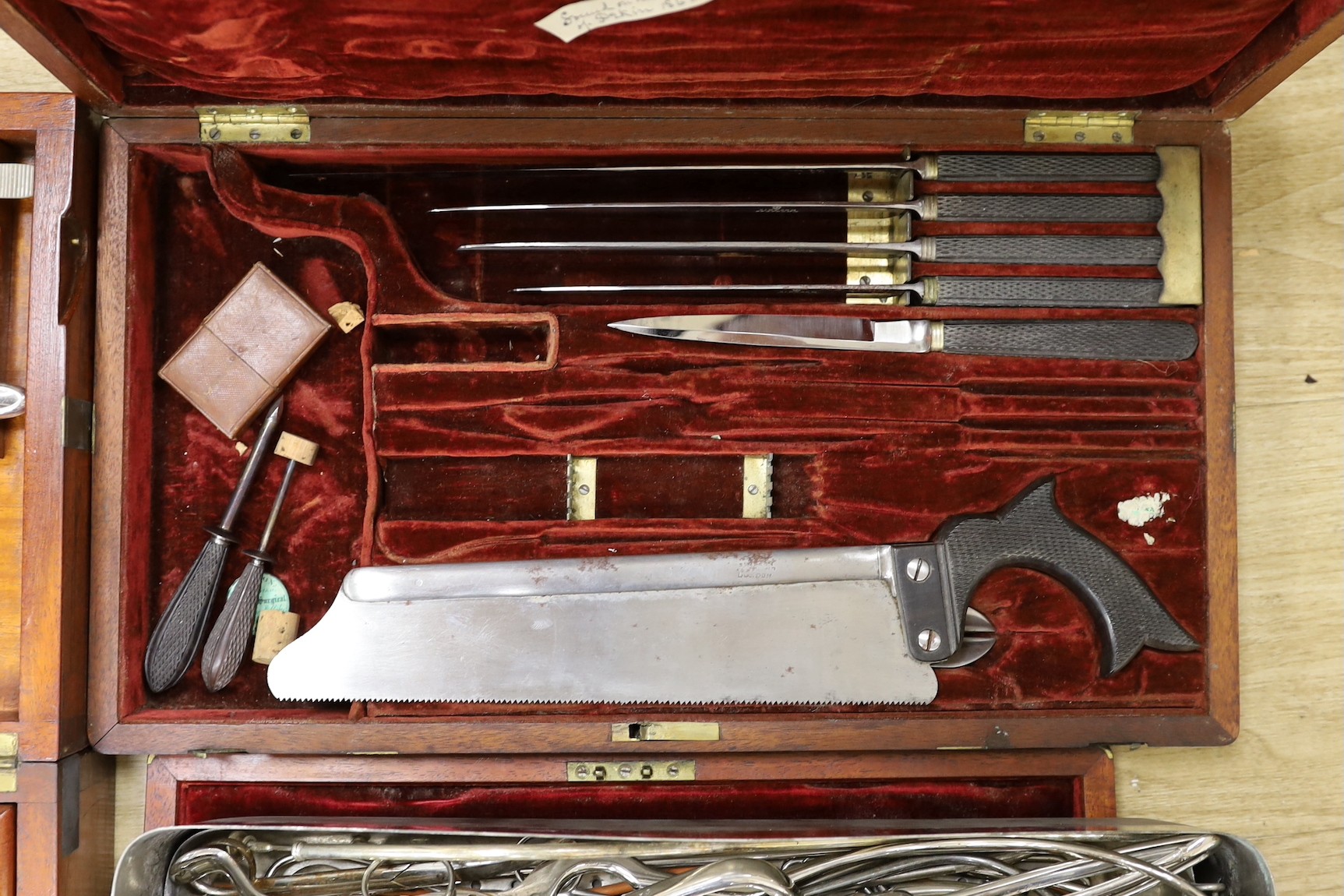 A 19th century mahogany cased field surgeon’s set (incomplete), and other field medical equipment, all three in brass banded mahogany boxes